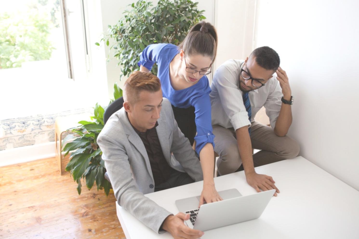 Professional team analyzing financial data and risk assessment reports